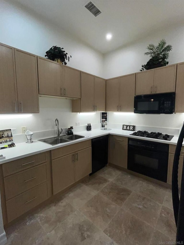 kitchen with sink and black appliances