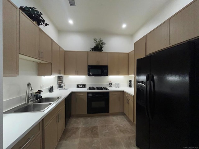 kitchen with sink and black appliances