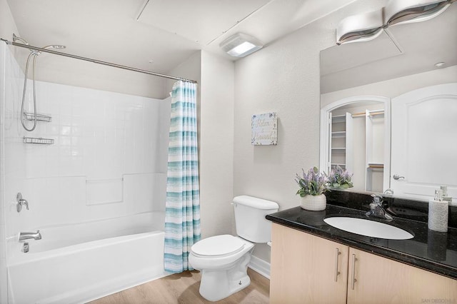 full bathroom with wood-type flooring, vanity, toilet, and shower / bath combo with shower curtain