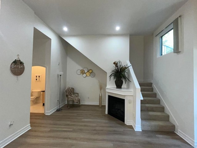 unfurnished living room with hardwood / wood-style flooring