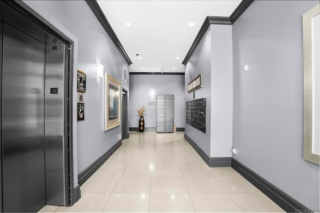 corridor featuring a package area, mail boxes, crown molding, and elevator