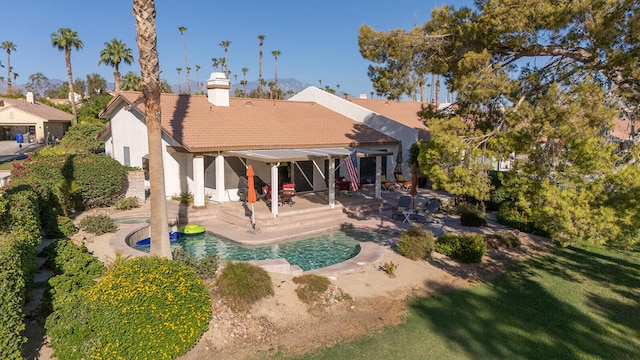 back of property featuring a patio