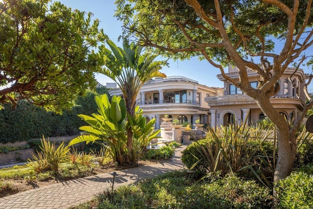 view of front of house featuring a balcony