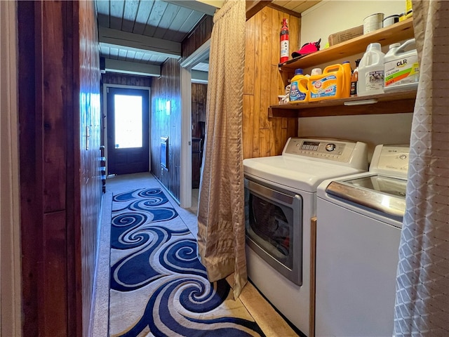 laundry room with separate washer and dryer, wood walls, and wooden ceiling