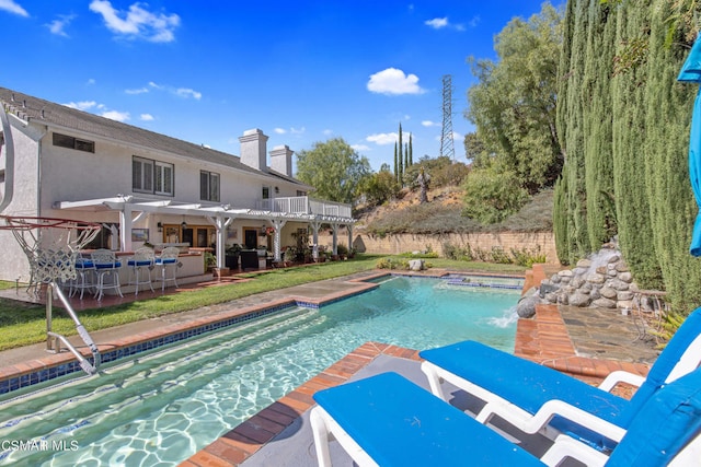 view of pool with an in ground hot tub and a patio