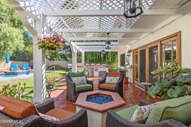 view of patio featuring a pergola and an outdoor kitchen