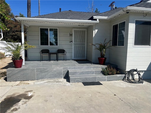 property entrance featuring a patio area