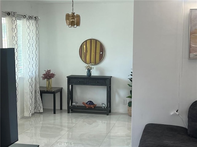 sitting room featuring an inviting chandelier