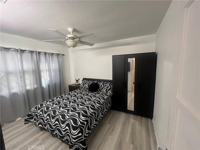 bedroom featuring ceiling fan and hardwood / wood-style floors