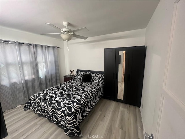 bedroom featuring ceiling fan and hardwood / wood-style floors