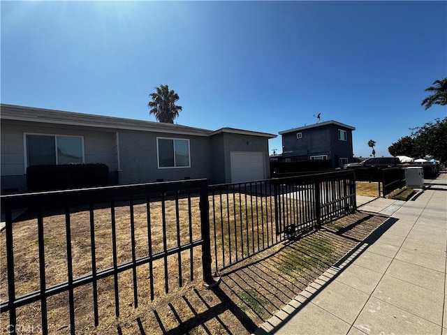 exterior space featuring a lawn and a garage