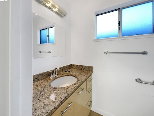 bathroom with vanity and plenty of natural light