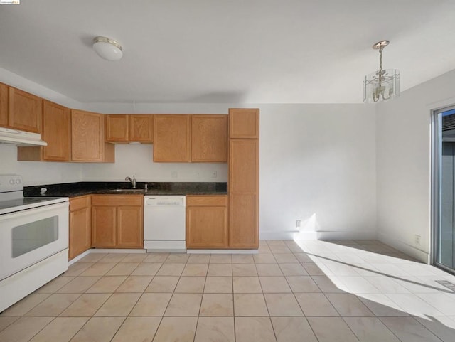 kitchen with light tile patterned floors, decorative light fixtures, white appliances, a chandelier, and sink