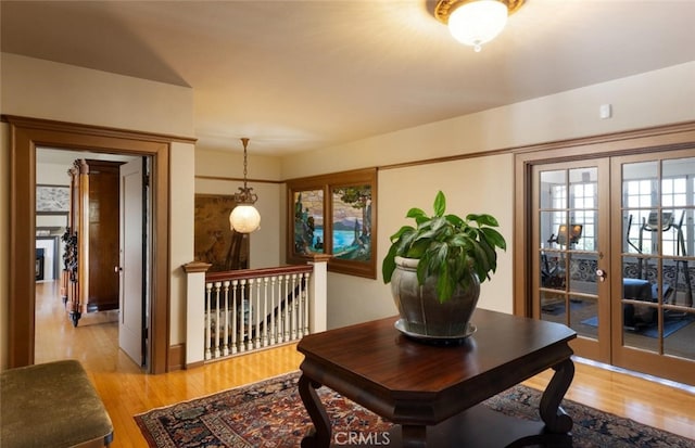 interior space featuring light hardwood / wood-style floors and french doors