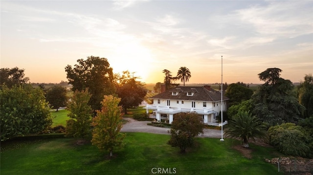 view of front of home with a yard