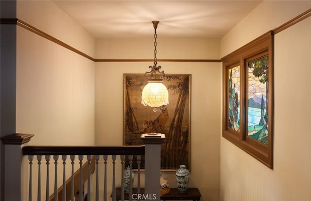 hallway featuring an inviting chandelier