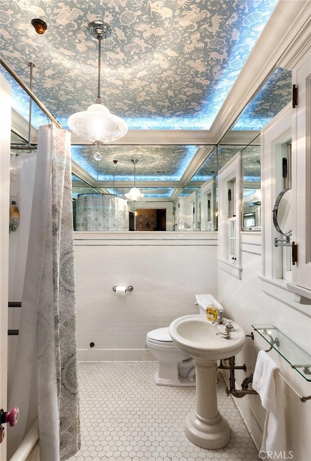 bathroom with sink, tile patterned flooring, toilet, and a shower with shower curtain