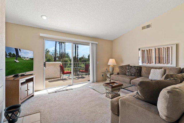 living room featuring a textured ceiling, vaulted ceiling, and light colored carpet