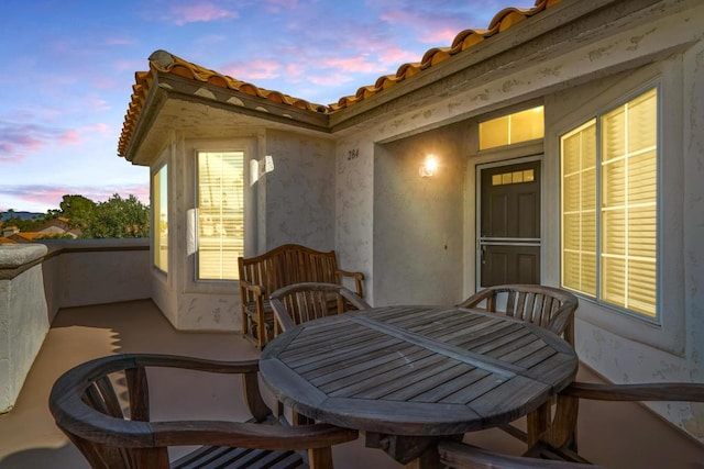 view of patio terrace at dusk