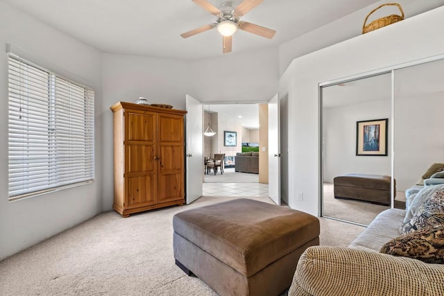 interior space with light colored carpet and ceiling fan