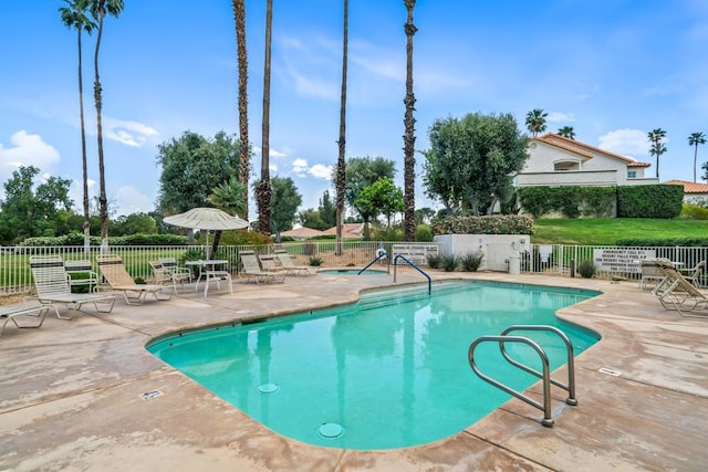 view of pool featuring a patio