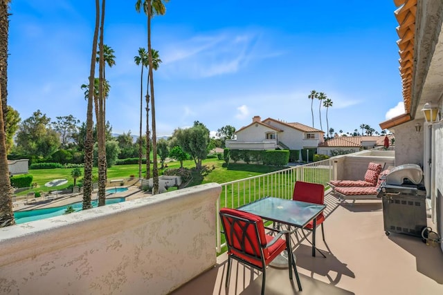 view of patio featuring a balcony and grilling area