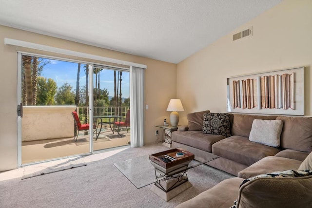 living room with vaulted ceiling and carpet