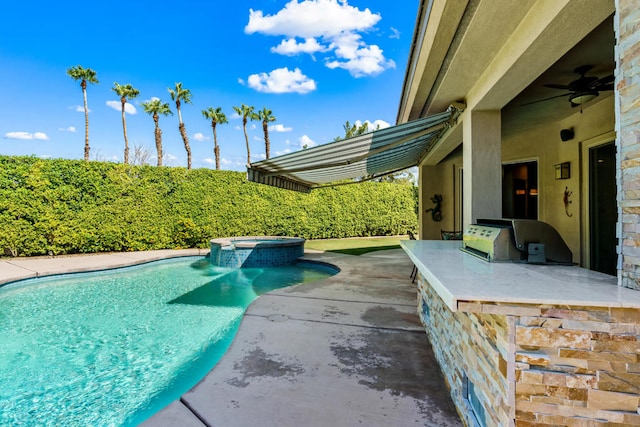 view of swimming pool with an in ground hot tub, ceiling fan, a patio area, and exterior kitchen