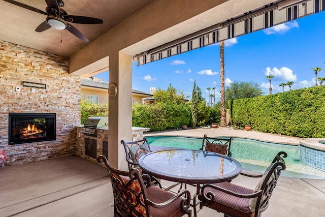 view of patio / terrace featuring area for grilling, ceiling fan, a fenced in pool, and a grill