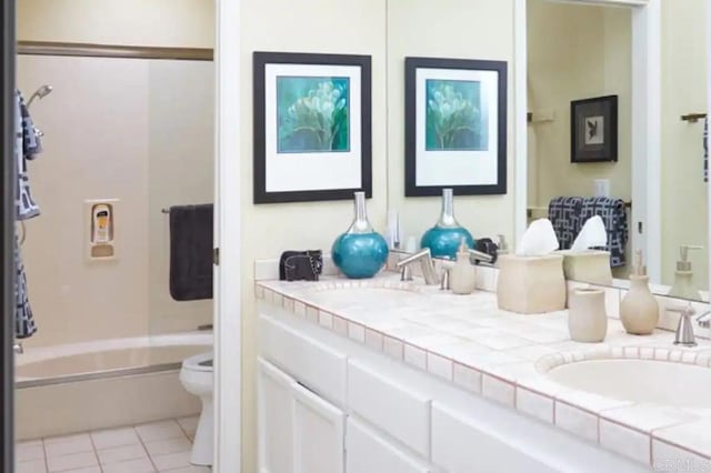 full bathroom with vanity, tile patterned flooring, toilet, and shower / bathtub combination