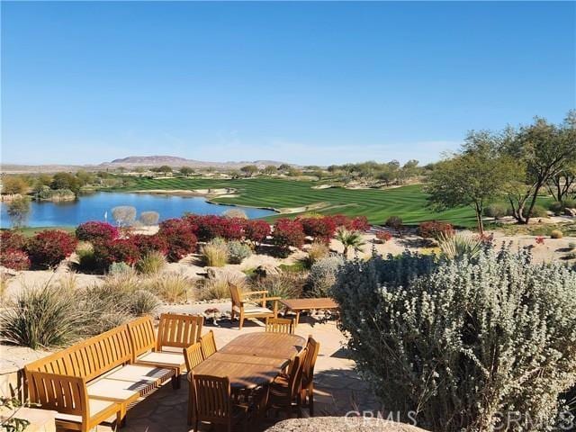 view of home's community featuring a water view and a patio area