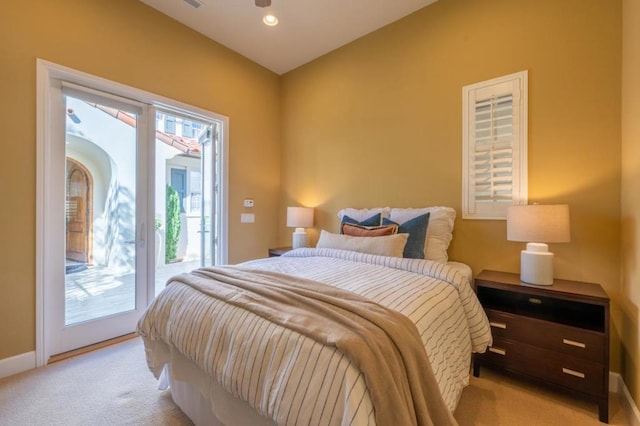 carpeted bedroom featuring access to outside and multiple windows