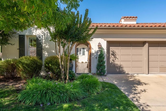 mediterranean / spanish house featuring a garage