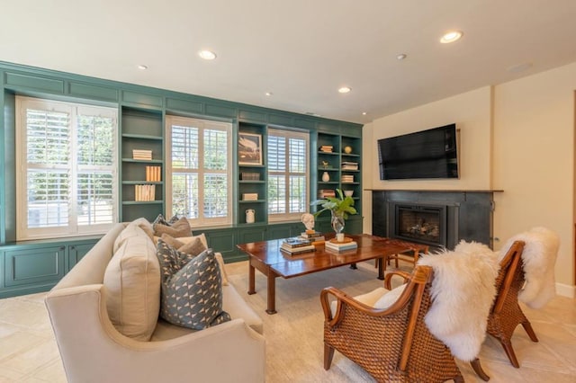 sitting room featuring built in shelves