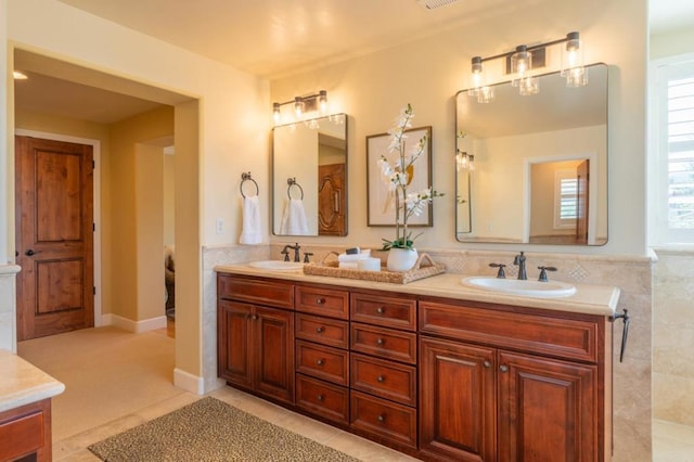 bathroom featuring tile patterned flooring and vanity