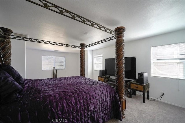 carpeted bedroom with a textured ceiling