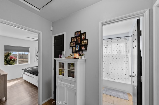 hall with light hardwood / wood-style flooring