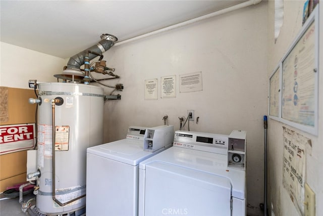 laundry room with gas water heater and independent washer and dryer