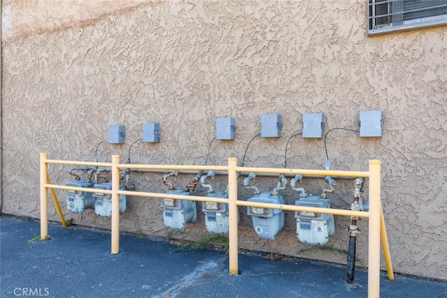details with gas meter and stucco siding