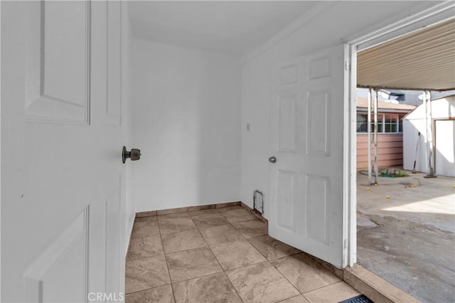 laundry room with baseboards