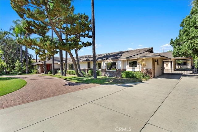 single story home featuring a carport