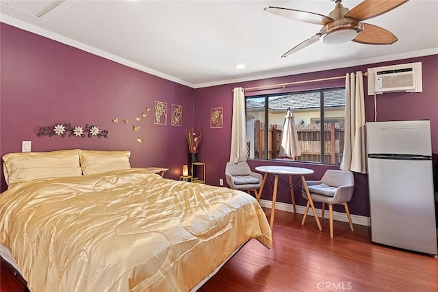 bedroom featuring refrigerator, ornamental molding, a wall mounted AC, ceiling fan, and wood-type flooring