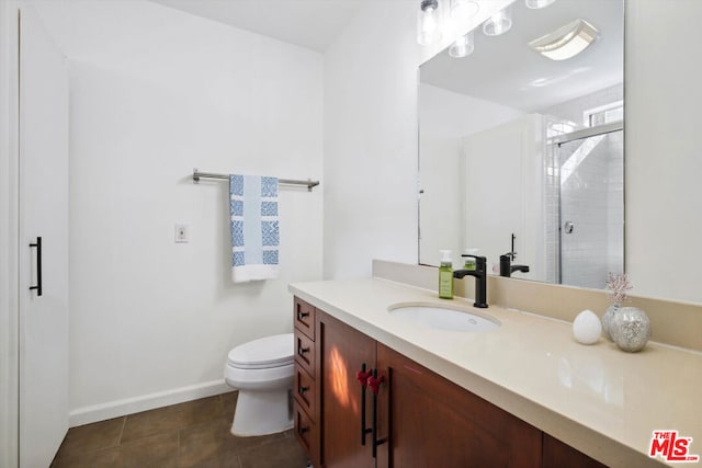 bathroom featuring vanity, toilet, an enclosed shower, and tile patterned floors