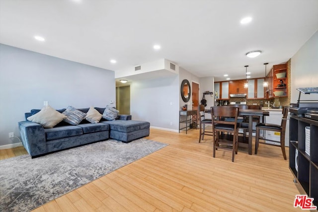 living room with light hardwood / wood-style flooring