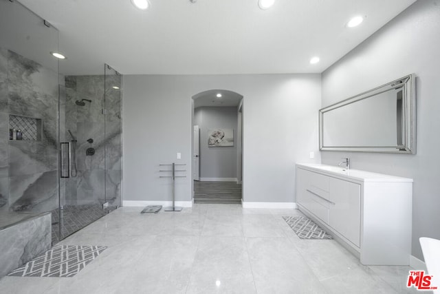 bathroom with vanity and an enclosed shower