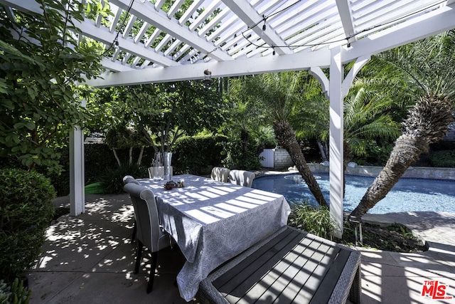 view of patio / terrace with a pergola and a fenced in pool