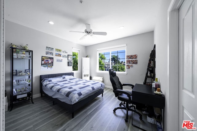 bedroom featuring ceiling fan and dark hardwood / wood-style flooring