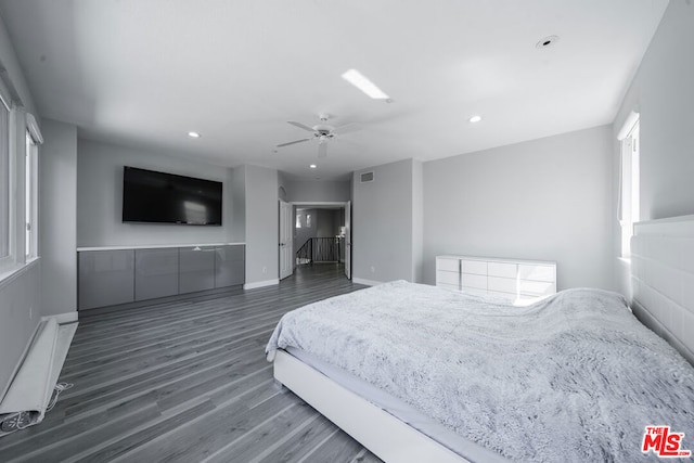 bedroom featuring ceiling fan and dark wood-type flooring