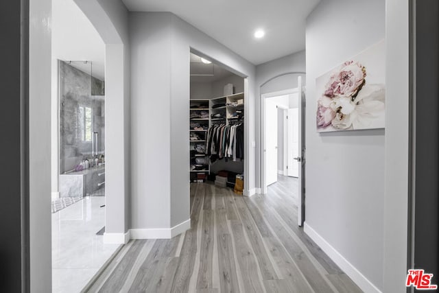 corridor featuring light hardwood / wood-style floors