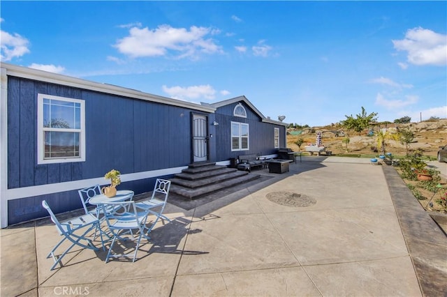 back of property featuring a patio area